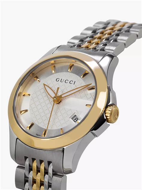 gucci watch silver and gold.